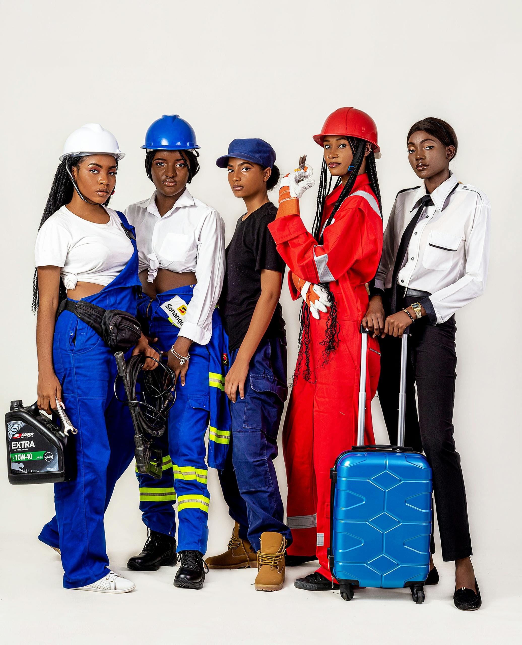 A group of women in different work outfits on a white background, showcasing job diversity.